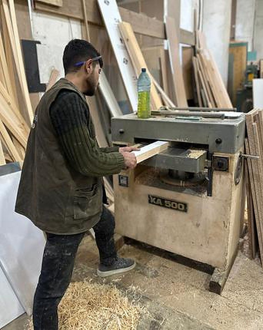 Craftsman using planer