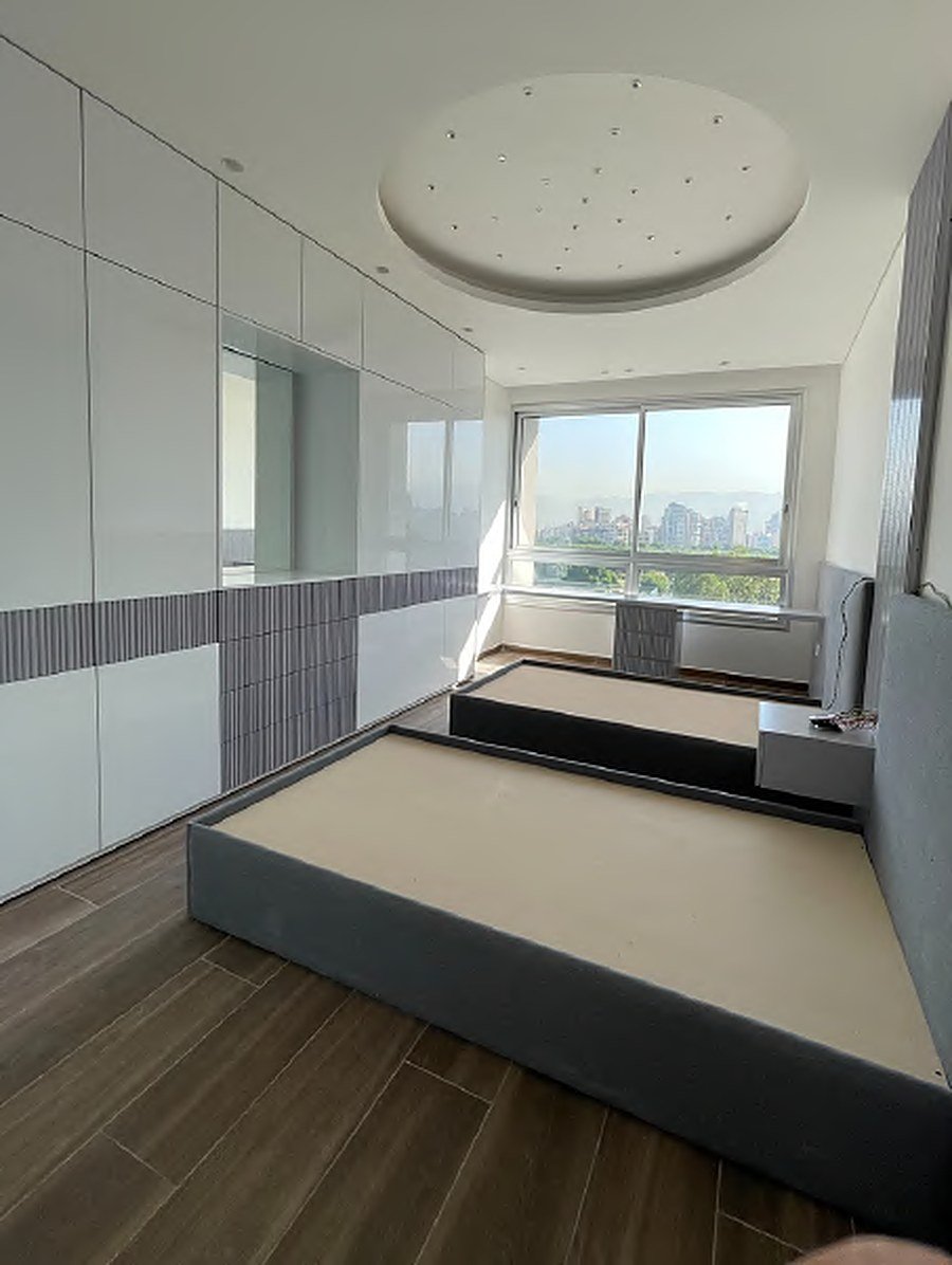 Bold orange wardrobe with scallop arch detail