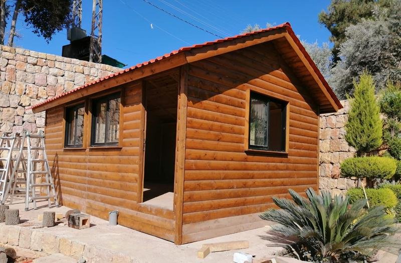 Aerial view of chalet bungalow in garden