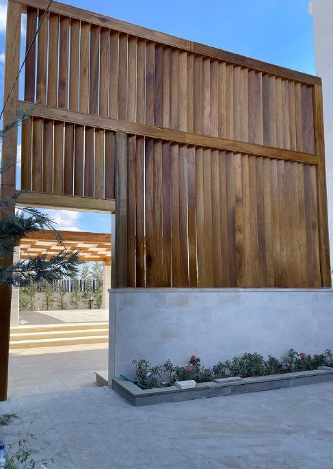 Warm cedar bungalow entrance with steps
