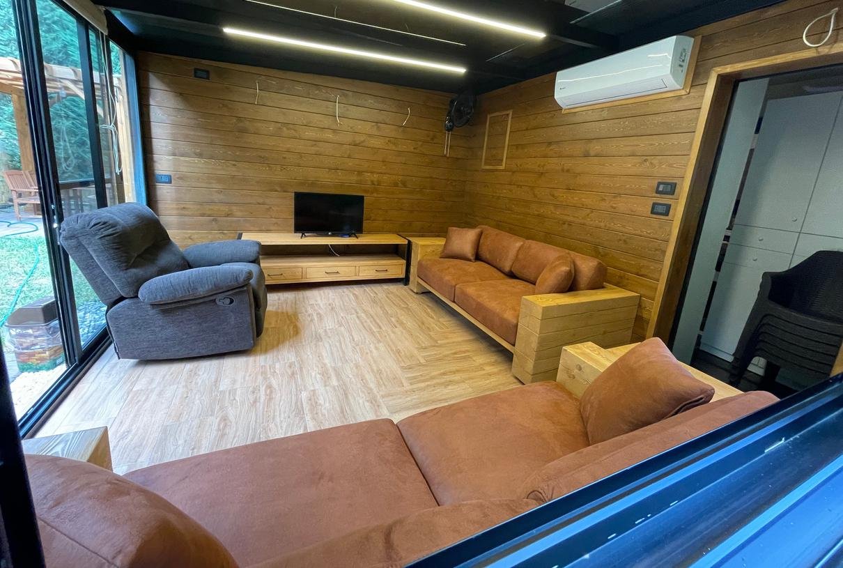 Bungalow interior: open plan with wood walls