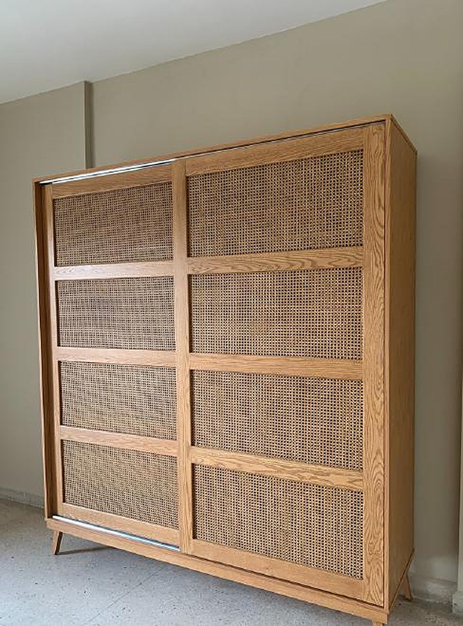 Closed oak wardrobe with rattan panel doors