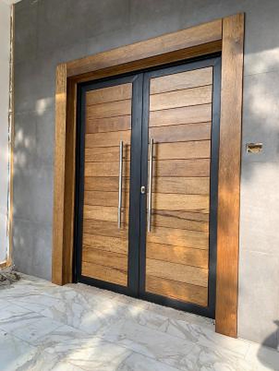 Full-height wood-panelled entrance with angled ceiling