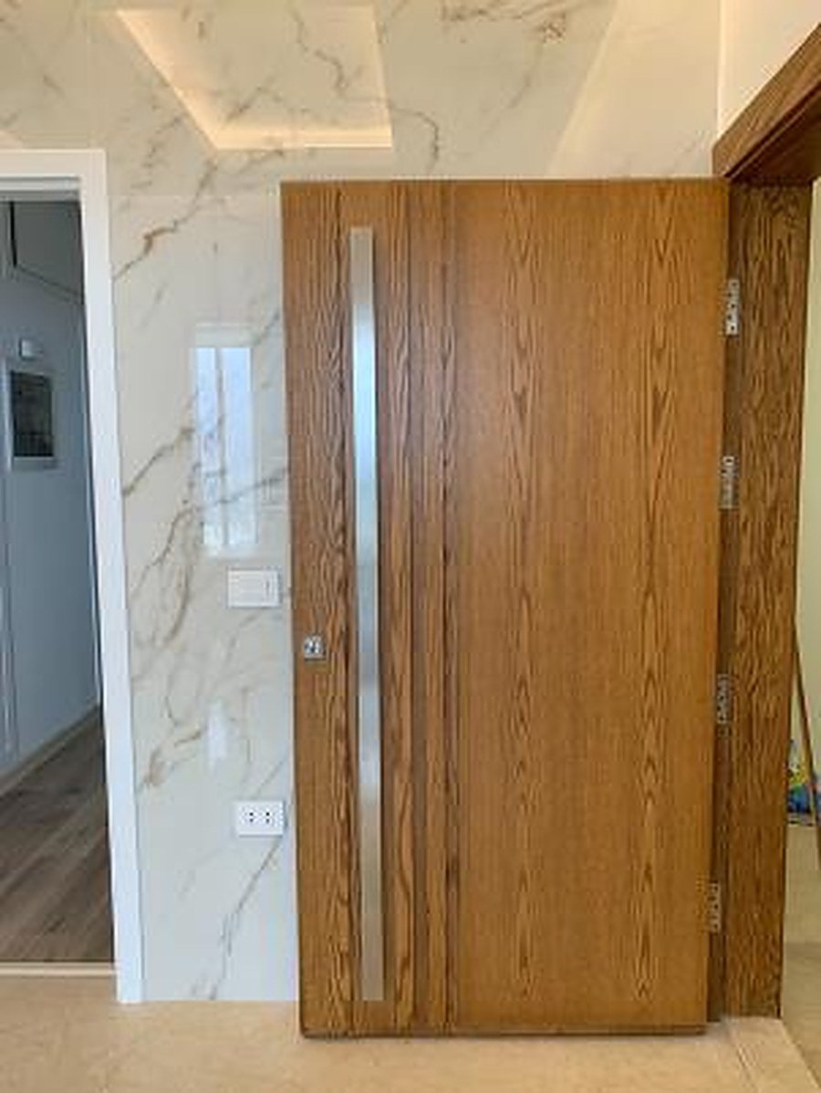 Modern wood entrance with vertical slat surround