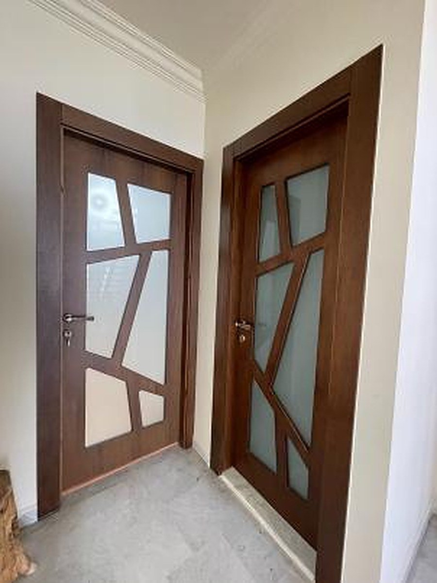 White interior door with solid wood side panel