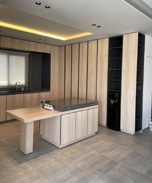 Spacious light wood kitchen — alternate angle