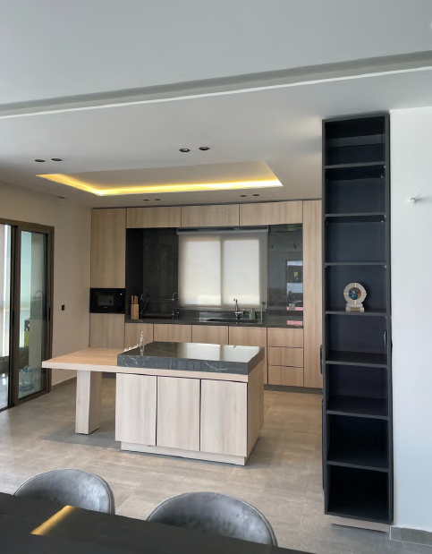 Full kitchen view with open pantry tower