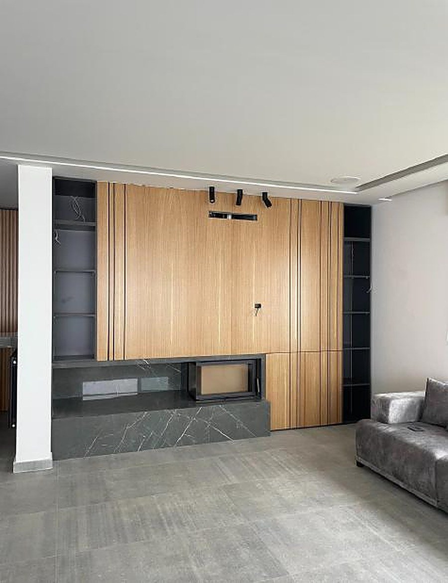 Full wall wood cladding with integrated TV niche