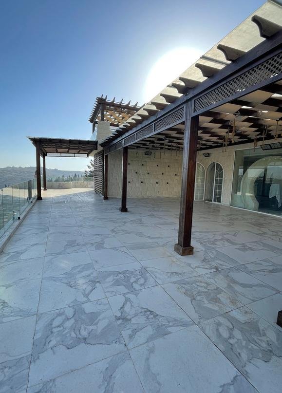 Compact terrace pergola with scenic mountain backdrop