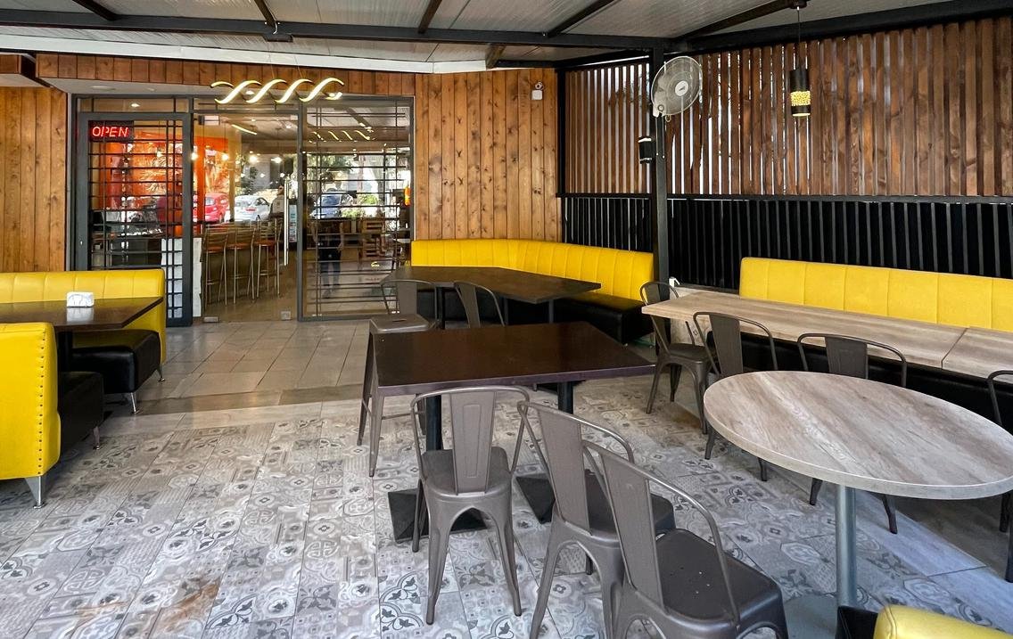 Restaurant side view with open wood ceiling